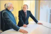  ?? REUTERS PHOTO ?? Prime Minister Narendra Modi with Russian President Vladimir Putin during a meeting on the sidelines of the St. Petersburg Internatio­nal Economic Forum on Thursday.