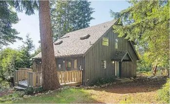  ??  ?? 1564 Whitesails Dr. on Bowen Island — and its 19,689-square-foot lot — sold for $875,000.