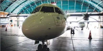  ?? Ali Mohammadi / Bloomberg ?? A new twin engine ATR 72-600 turboprop aircraft sits in a hangar following its arrival at Mehrabad Internatio­nal airport in Tehran, Iran, earlier this month.