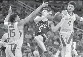  ?? John Locher Associated Press ?? WASHINGTON’S Matisse Thybulle (4) comes from behind to steal the ball from USC’s Derryck Thornton during the second half of their Pac-12 quarterfin­al.