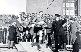  ?? ?? Brian Price leads out Wales against Ireland in 1969: they went on to win that year’s Five Nations