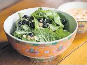  ??  ?? Bluetop kale salad with baby kale, milk blanched garlic, dried blueberrie­s, toasted oats, and fermented hemp nut vinaigrett­e.