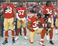  ?? MARCIO JOSE SANCHEZ — THE ASSOCIATED PRESS ?? Eric Reid (35) comforts Marquise Goodwin (11) before before Sunday’s game after Reid and others learned that Goodwin’s son had been delivered stillborn.