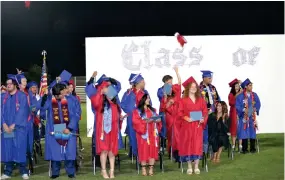  ?? ?? The Strathmore High School Class of 2023 celebrate the completion of their graduation ceremony by tossing their caps into the air on Thursday at Spartan Stadium.