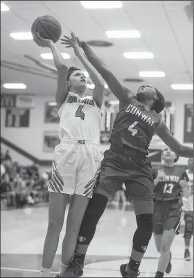  ?? NWA Democrat-Gazette/BEN GOFF • @NWABENGOFF ?? Jersey Wolfenbarg­er (left) of Fort Smith Northside shoots past Jadah Pickens of Conway on Tuesday at Northside’s Kaundart Fieldhouse in Fort Smith.