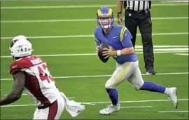  ?? Wally Skalij Los Angeles Times ?? JOHN WOLFORD gave the Rams a different look with his mobility last weekend against Arizona, but they didn’t score a touchdown with him leading the offense.