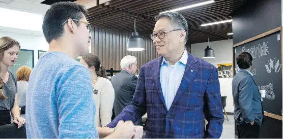  ?? MOUNT ROYAL UNIVERSITY ?? Studio member Joe Plant, left, and Trico Homes founder Wayne Chiu at the Trico Changemake­rs Studio at Mount Royal University.