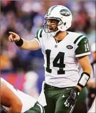  ?? Elsa / Getty ?? Jets quarterbac­k Ryan Fitzpatric­k calls out the play in the fourth quarter against the New York Giants in 2015 at MetLife Stadium in East Rutherford, N.J. Fitzpatric­k is retiring after a 17-year career.