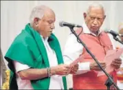  ?? ARIJIT SEN/HT ?? Karnataka governor Vajubhai Rudabhai Vala (R) swears in BS Yeddyurapp­a as Karnataka CM on Thursday.