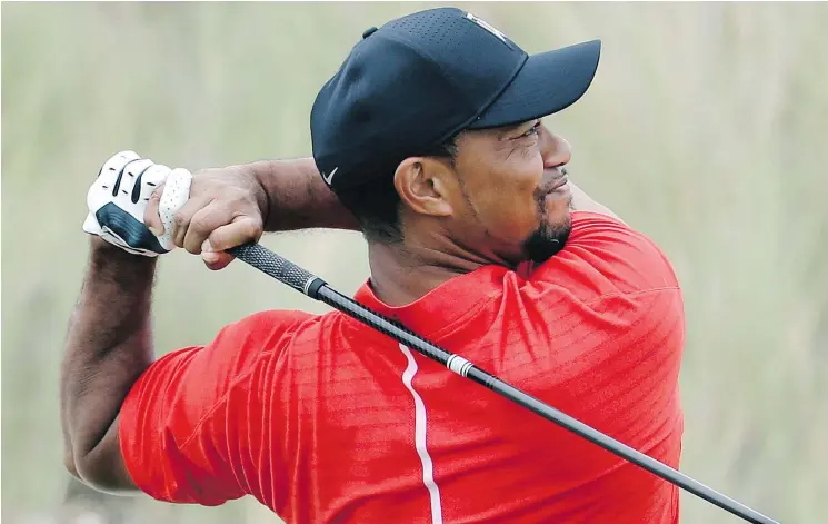  ?? — THE ASSOCIATED PRESS FILES ?? Tiger Woods, who had surgery on his back in April, will make his return to profession­al golf this week at the Hero World Challenge in the Bahamas.