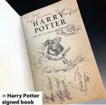  ??  ?? > Harry Potter signed book