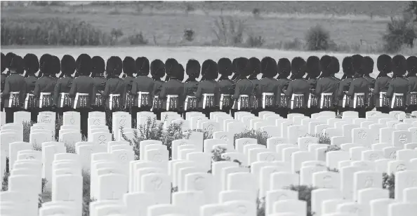  ?? JOHN THYS / AGENCE FRANCE-PRESSE / GETTY IMAGES ?? British Foot Guards participat­e in commemorat­ions for the 100th anniversar­y of the Battle of Passchenda­ele, which took place between July 31 and Nov. 6, 1917, in Belgium.