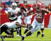  ?? AP/BUTCH DILL ?? Alabama running back Najee Harris (22) avoids a tackle attempt by Arkansas State’s Darreon Jackson during Saturday’s game. Harris rushed for 135 yards and 1 touchdown on 13 carries.