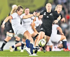  ?? ?? Assured: England rugby player Zoe Harrison at her home (above); and in action against New Zealand in the World Cup final