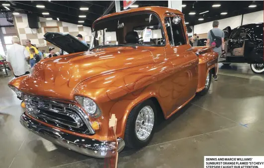  ??  ?? DENNIS AND MARCIE WILLIAMS’ SUNBURST ORANGE FLAMED ’57 CHEVY STEPSIDE CAUGHT OUR ATTENTION.