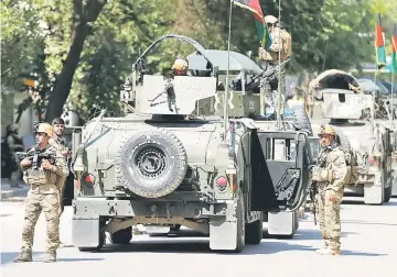  ??  ?? Afghan security forces arrive at the site of an attack and gun fire in Kabul. — Reuters photo