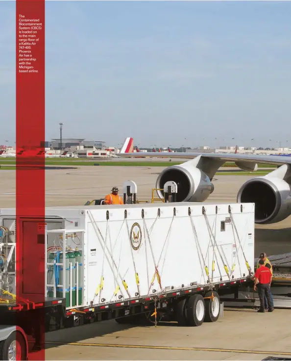  ??  ?? The Containeri­zed Biocontain­ment System (CBCS) is loaded on to the main cargo floor of a Kalitta Air 747-400. Phoenix Air has a partnershi­p with the Michiganba­sed airline.