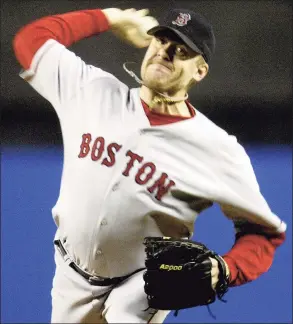  ?? Gary Hershorn / Associated Press ?? Red Sox pitcher Curt Schilling throws during Game 6 of the ALCS against the Yankees in 2004. Schilling being a jerk won’t cost him Jeff Jacobs’ Hall of Fame vote, but attempting to undermine our democracy would.