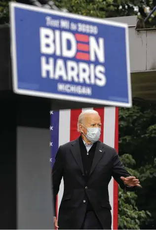  ?? Chip Somodevill­a / Getty Images ?? Democratic presidenti­al nominee Joe Biden arrives for a campaign appearance in Grand Rapids, Mich. Biden said he tested negative twice for the novel coronaviru­s on Friday.