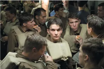  ??  ?? Fionn Whitehead as a young British soldier in Christophe­r Nolan’s film Dunkirk