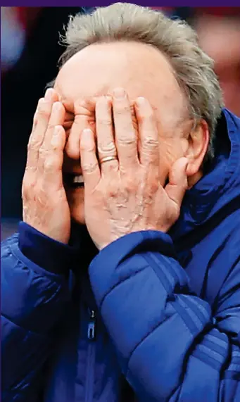  ?? GETTY IMAGES ?? Can’t watch: Neil Warnock fails to hide his despair on Saturday