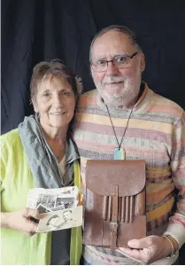  ?? PHOTO: LINDA ROBERTSON ?? Back in family hands . . . Elainee Witehira (left) reunites Axel Fickeis, of Germany, with his father’s satchel and some of its contents.