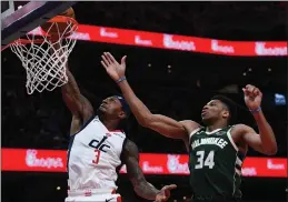  ?? File photo ?? Giannis Antetokoun­mpo, right, and the Milwaukee Bucks are favorites to reach the NBA Finals a season after losing to Tonrot in the Eastern Conference final.