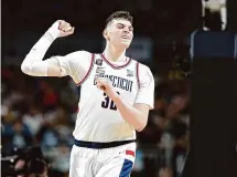  ?? Christian Petersen/Getty Images ?? Donovan Clingan is slated to fly down to Miami on Sunday to begin workouts in preparatio­n for the 2024 NBA Draft.