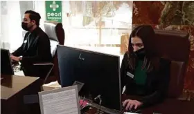  ?? MichaelWyk­e / Contributo­r ?? Adrian Martinez and Lauren DeJoe work in the leasing office at the Pearl Marketplac­e in Midtown, part of the Morgan Group.