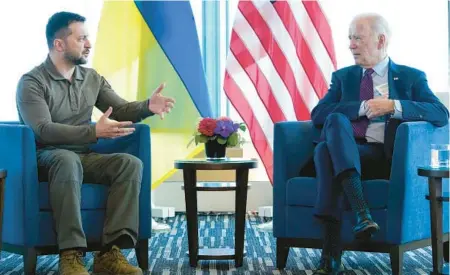  ?? SUSAN WALSH/AP ?? President Joe Biden, right, meets with Ukrainian President Volodymyr Zelenskyy on Sunday in Japan.