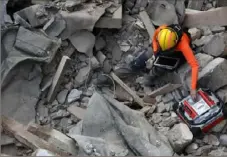  ?? Hussein Malla/AP Photo ?? A Chilean rescuer uses a sound tracking machine at the site of a collapsed building in Beirut, Lebanon, on Sept. 4, 2020.