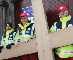  ??  ?? Gerard Kavanagh, Stephen O Donogue and John Rooney of the Irish Red Cross at the Carrying of the Cross procession on Good Friday.