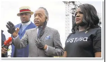  ??  ?? President Trump on Friday said protesters at his rally in Oklahoma won’t be treated as nicely as those in New York. The Rev. Al Sharpton with Rev. Robert Turner and Tiffany Crutcher, lead Juneteenth celebratio­ns Friday in Tulsa ahead of political event, which takes place Saturday at an indoor arena.