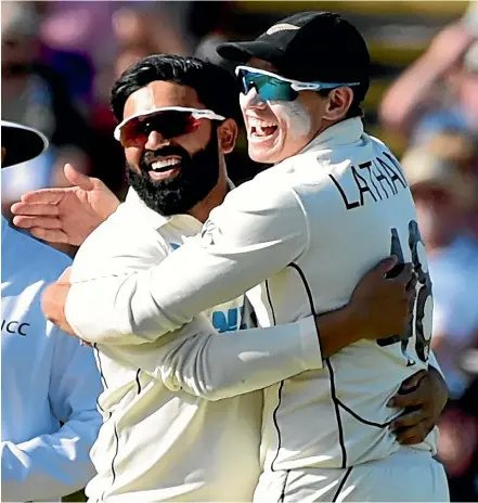  ?? AP ?? Ajaz Patel, left, and stand-in Black Caps captain Tom Latham celebrate the prize scalp of Joe Root during the second test at Edgbaston in Birmingham, won by New Zealand by eight wickets.