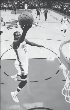  ?? SUE OGROCKI/ AP ?? Thunder superstar Kevin Durant recorded his first NBA triple- double with 25 points, 13 rebounds and a career- high 10 assists against theWarrior­s.