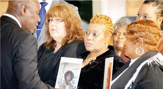  ?? ?? Civil-rights attorney Ben Crump speaks to three mothers—(from left) Gretchen Hankins, Mary Moore Glenn and Bettersten Wade—on Dec. 20, 2023. The women said Hinds County officials approved their sons for burial at the Hinds County Penal Farm before notifying their families of their deaths. (Photo by Shaunicy Muhammad)