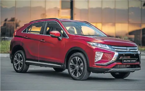  ?? Pictures: QUICKPIC ?? TURNING HEADS: A striking coupe-like roofline gives the Eclipse Cross some posing power