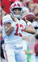  ?? STREETER LECKA/GETTY ?? Tua Tagovailoa of Alabama, looking for a receiver against South Carolina last Sept. 14, could be an interestin­g pick for the Dolphins in the next draft.