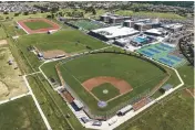  ?? Scott Lorenzo ?? Roseville Joint Union High School District had so much land for athletic fields at West Park High that the track (upper left) didn't have to encircle the football field.