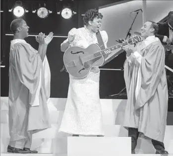  ?? Photograph­s by Jim Cox Photograph­y ?? IN “SHOUT SISTER SHOUT!” at the Pasadena Playhouse, Sister Rosetta Tharpe is portrayed by Tracy Nicole Chapman, who is flanked here by Thomas Hobson, left, and Armando Reinaldo Yearwood Jr.