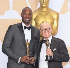  ?? DAN MACMEDAN/USA TODAY ?? Kobe Bryant, left, and Glen Keane, won the Oscar for best animated short for “Dear Basketball” at the 90th Academy Awards in 2018.