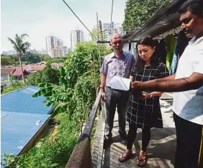  ??  ?? Grassroot focus: Yeoh, here with former Segambut MP Lim Lip Eng, visiting a resident. The deputy minister now reserves Saturdays for going down to Segambut and meeting her constituen­ts.