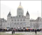  ?? Sophie Vaughan / Hearst Connecticu­t Media ?? Marchers gather outside the Capitol building in Hartford during the Women’s March Connecticu­t in January.