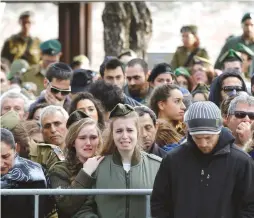  ?? (Reuters) ?? RELATIVES AND FRIENDS mourn during the funeral of IDF soldier Lt. Yael Yekutiel, who was killed on Sunday in the Jerusalem truck-ramming attack by a Palestinia­n terrorist.