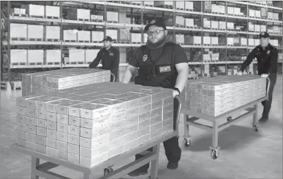  ?? $ $ ?? FLYING OUT THE DOOR: Lucky Georgia residents are hoping to find their zip code listed in today’s publicatio­n, but not everybody will. That’s why those who do need to immediatel­y call the State Distributi­on Hotlines. Everyone who does is authorized to claim sealed Vault Bricks loaded with the only Georgia State Gold Bank Rolls known to exist for the lowest ever 4 per coin minimum set for Georgia residents - non-state residents and those who miss the 48 hour deadline must pay 8 per coin, if any remain.