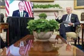  ?? ANDREW HARNIK — THE ASSOCIATED PRESS ?? President Joe Biden speaks during a virtual meeting with Ireland’s Prime Minister Micheal Martin on St. Patrick’s Day, in the Oval Office on Wednesday in Washington.