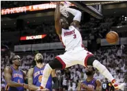  ?? LYNNE SLADKY — THE ASSOCIATED PRESS FILE ?? Miami Heat’s Dwyane Wade (3) scores on a dunk as New York Knicks’ Amare Stoudemire (1) and Tyson Chandler (6) look on in the first half of an NBA basketball game in the first round of the Eastern Conference playoffs in Miami, April 28, 2012. Wade was announced Friday, Feb. 17, 2023, as being among the finalists for enshrineme­nt later this year by the Basketball Hall of Fame. The class will be revealed on April 1.