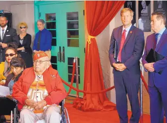  ?? ADOLPHE-PIERRE LOUIS/JOURNAL ?? Councilor Ken Sanchez, right, joins Mayor Tim Keller to honor Navajo Code Talker Joseph Vandever as the group of World War II heroes was inducted into the Albuquerqu­e Wall of Fame on Friday.