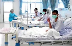  ?? AP ?? In this image made from video released by the Thailand Government Spokesman Bureau, three of the 12 boys are seen recovering in their hospital beds after being rescued along with their coach from a flooded cave in Mae Sai.