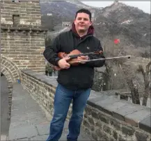  ??  ?? Aidan Lennon on the Great Wall of China.